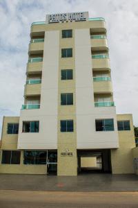 a building with a sign on the side of it at Patos Hotel in Patos de Minas