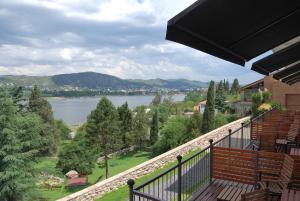 a balcony with a view of a lake at Tagore Suites Hotel in Villa Carlos Paz