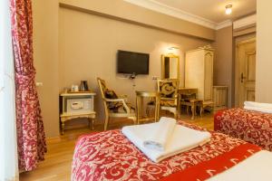 TV a/nebo společenská místnost v ubytování Saba Sultan Hotel