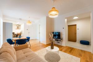 a living room with a couch and a table at Komandandi City Center Apartments in Kuressaare