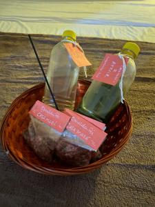 a basket with three bottles of food in it at Casa Maré in Soure +21 photos