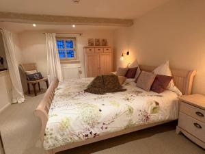 a bedroom with a large bed with a white comforter at Fachwerkliebe Ornes 1 in Olsberg