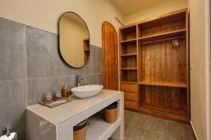 a bathroom with a sink and a mirror at Rest U Guest House in Nusa Penida +43 photos