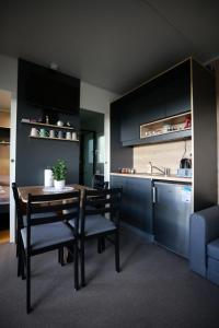 a kitchen and dining room with a table and chairs at Ivan in Kalnik