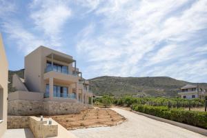 a house on a hill with a road at Falasarna Bay Hotel in Falasarna