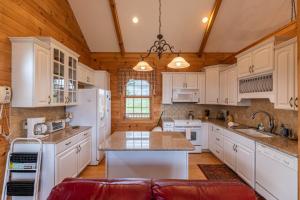 a kitchen with white appliances and wooden ceilings at Buena Vista in Todd +31 photos