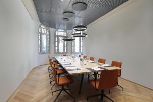 a large conference room with a long table and chairs at Best Western Plus Hotel Bern in Bern