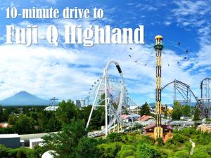 a roller coaster at an amusement park with the words minute drive to full o at PICA Fujiyoshida in Fujiyoshida
