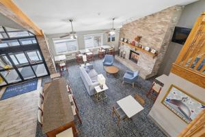 an overhead view of a living room with a fireplace at AmericInn by Wyndham White Bear Lake St. Paul in White Bear Lake