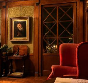 a room with a painting of a man on the wall at Resort Dei Limoni Tower Inn in Lucca +60 photos
