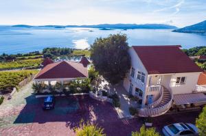 an aerial view of a house with a view of the water at Hotel Pansion Villa Antonio in Orebić