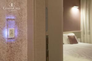 Postel nebo postele na pokoji v ubytování Centro Città Luxury B&B