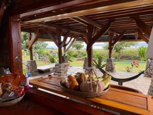 a bowl of fruit on a table in a room at Lakey Views Sumbawa in Huu