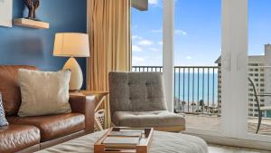 a living room with a couch and a chair at Laketown Wharf 809 in Panama City Beach