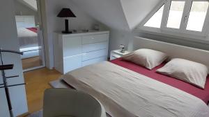 a bedroom with a large bed with a window at Villa-Mainaue in Maineck +17 photos