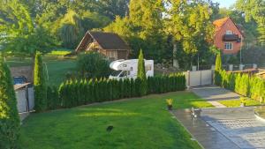 an aerial view of a backyard with a rv in the yard at Villa-Mainaue in Maineck