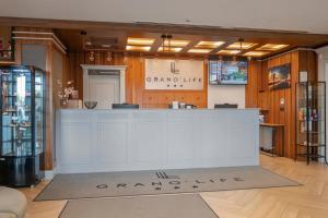 a store with a white counter in a room at GRANO LIFE Gdańsk in Gdańsk