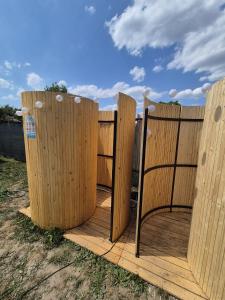 a wooden fence with a chair in front of it at The Nest Room in Bontida