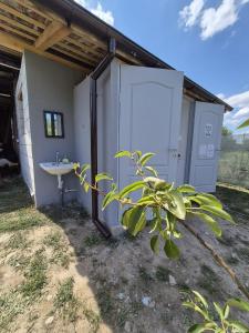 a bathroom with a sink next to a building at The Nest Room in Bontida +8 photos