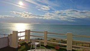 a view of the ocean from a balcony at La Bournonville in Ault +16 photos