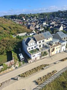 an aerial view of a large white house at La Bournonville in Ault