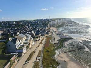 an aerial view of a beach with a group of houses at La Bournonville in Ault