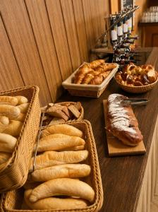 a table topped with baskets of bread and pastries at Chata Návrší in Stříbrnice