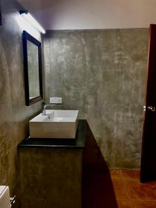 a bathroom with a sink and a mirror at Raniya Villa in Bentota +11 photos
