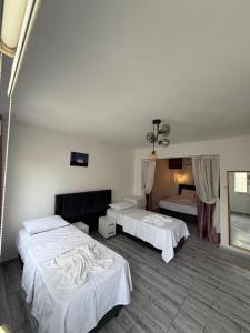 a hotel room with two beds and two bedsvisor at Hotel Buse in Alaçatı +20 photos