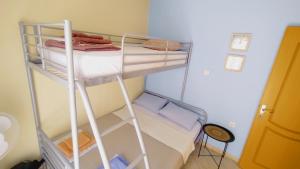 a room with two bunk beds in a room at Teos in Metamorfosi