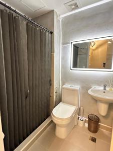 a bathroom with a toilet and a sink at JB's Space in Cagayan de Oro