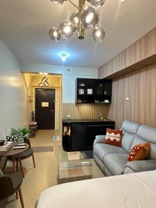 a living room with a couch and a fire place at JB's Space in Cagayan de Oro