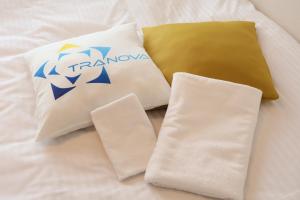 a group of pillows sitting on top of a bed at Joinus Ise Apartment by Tranova in Ise