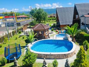 an overhead view of a swimming pool with a gazebo at Sunny Cottage in Martvili