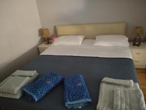 a bedroom with a bed with two pillows on it at Studio47 in Athens +42 photos