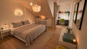 a bedroom with a large bed in a attic at Maisonette Wohnung WALDLOFT in Mehlmeisel
