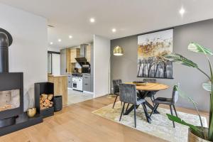 a kitchen and dining room with a table and chairs at Villa Boréal with spa in the heart of St Gilles in Saint-Gilles-Croix-de-Vie