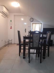 a dining room with a table and chairs at Apartmani Goga in Pirovac +15 photos