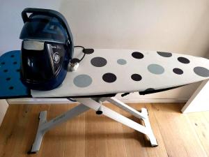 a snowboard sitting on top of a table at Garden villa Raanana in Ra‘ananna
