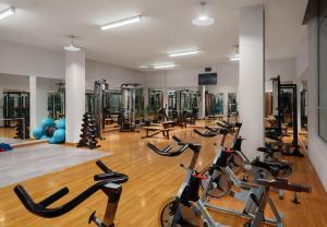 a gym with a bunch of exercise bikes at Ani Plaza Hotel in Yerevan