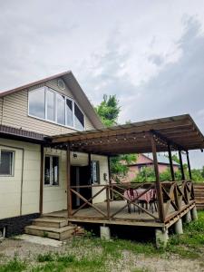 a porch with awning on a house at Дом твоей силы in Talghar
