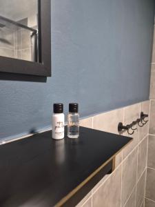 two bottles of liquids sitting on a counter in a kitchen at 52 on 2nd Self-catering accommodation in Gonubie Park +5 photos