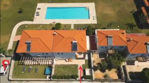 an aerial view of a house with an orange roof at Villa Kadrina in Kolymbia