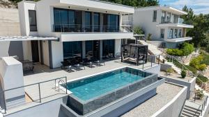 an aerial view of a house with a swimming pool at Villa Evia by Villas Guide in Smokvica