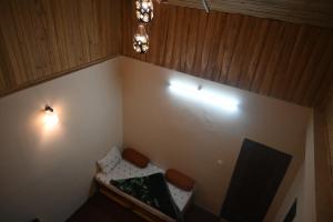 an overhead view of a corner of a room with a tv at Denzongpa Homestay in Takdāh