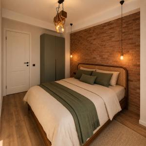 a bedroom with a large bed with a brick wall at Matilda Signature Apartments in Telavi