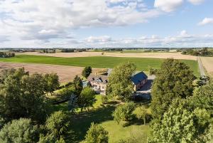 an aerial view of a house in a field at Ludvigsdals Gård in Ystad