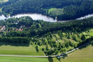 an aerial view of a park with a river and trees at Hauszeit mit Pfoten in Litschau +14 photos