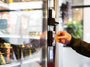 a person is unlocking a door in a store at hotelF1 Villepinte Parc des Expositions in Villepinte