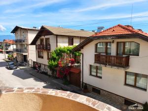 an overhead view of a house with a bridge at Emara Lodge Bansko in Bansko